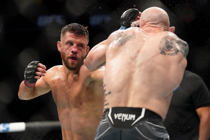 Josh Emmett (blue gloves) fights Calvin Kattar (red gloves) in the featherweight main event fight during UFC Fight Night at Moody Center.